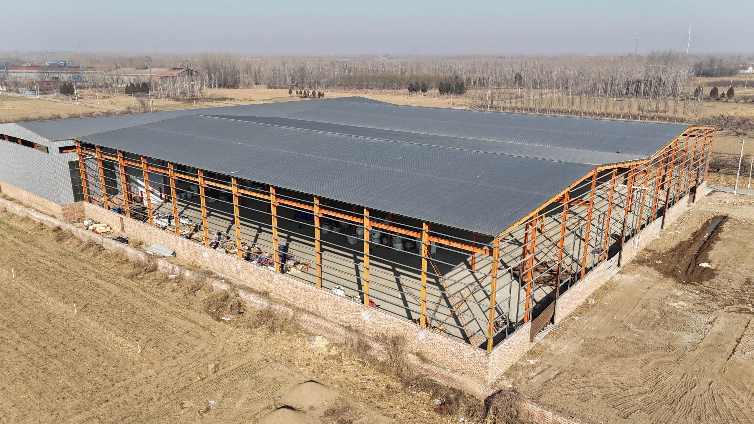Steel Structure vs. Concrete Building: Which Is Better for Warehouses & Factories? (2026)